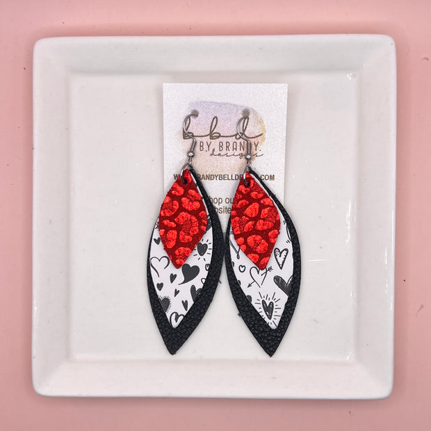 DOROTHY -  Leather Earrings  ||   <BR>METALLIC RED LEOPARD, <BR> BLACK SCRIBBLED HEARTS, <BR> MATTE BLACK